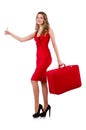 Hitchhiker woman in red dress with suitcase