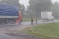 Hitchhikers in the rain Royalty Free Stock Photo