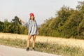 Hitchhiking on a country road Royalty Free Stock Photo