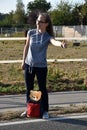 Hitchhiking cute teenage girl Royalty Free Stock Photo