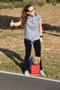 Hitchhiking cute teenage girl Royalty Free Stock Photo