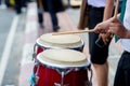 Hitting an African drums. Play on a musical instrument Drummer. Drum sticks hitting the drum. Royalty Free Stock Photo