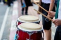 Hitting an African drums. Play on a musical instrument Drummer. Drum sticks hitting the drum. Royalty Free Stock Photo