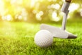 Hitting golf ball with club in park. Space for design Royalty Free Stock Photo