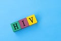 HIV - Human Immunodeficiency Virus acronym on colorful wooden block cubes.