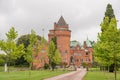 Hjularod castle is a romantick red castle inside a park on a green lawn Royalty Free Stock Photo