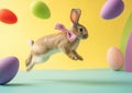 Hliday easter rabbit with bow jumping and decorated easter eggs flying around, isolated on neutral background Royalty Free Stock Photo