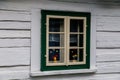 Hlinsko, Vysocina, Czech Republic, 15 April 2022: Traditional village wooden farm house, Flower eggs on windows, white wall and