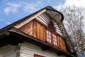 Hlinsko, Vysocina, Czech Republic, 15 April 2022: Traditional village wooden farm house at summer sunny day, historic country-