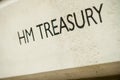 HM TREASURY sign on building exterior.