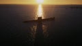 HMAS Otama Submarine with sunrise reflecting off the ocean