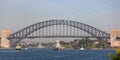 HMAS Perth FFH 157 Anzac-class frigate of the Royal Australian Navy sailing under the iconic Sydney Harbor Bridge