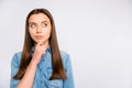 Hmm what to do... Portrait of pensive interested girl touch her chin think about studying learning problems try decide Royalty Free Stock Photo