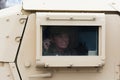 HMMWV Military vehicle with soldier looking out the window Royalty Free Stock Photo