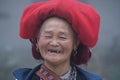 Hmong ethnic woman in traditional dress on the street in mountain village in Sapa region, North Vietnam, close up