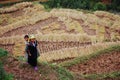 Hmong woman with her son on the rice field at Sapa town, northern Vietnam