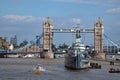 HMS Belfast moored in front of Tower Bridge on the River Thames. London, UK. Royalty Free Stock Photo