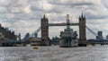 HMS Belfast moored in front of Tower Bridge on the River Thames in the United Kingdom Royalty Free Stock Photo