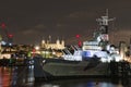 HMS Belfast with Tower of London at night