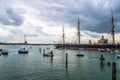 HMS Warrior surrounded by boats at Portsmouth