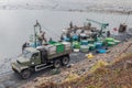 Fishermen team harvesting fish pond. Catch of carps for christmas market in Bo