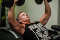 Hnadsome young man working out with dumbbells in fitness - powe Royalty Free Stock Photo