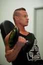 Hnadsome young man working out with dumbbells in fitness - powe Royalty Free Stock Photo