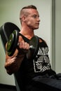 Hnadsome young man working out with dumbbells in fitness - powe Royalty Free Stock Photo