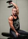 Hnadsome young man working out with dumbbells in fitness - powe Royalty Free Stock Photo