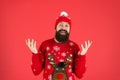 Ho ho ho. brutal hipster in knitted hat. wear christmas mood. knitwear male fashion. funny looking man. new year party Royalty Free Stock Photo