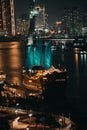 Ho Chi Minh city at night, Elisa Sailboat, a floating restaurant, Far away is landmark 81 skyscraper and Thu Thiem peninsula Royalty Free Stock Photo