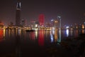 Ho Chi Minh City 12/29/2013 at night skyscrapers with lights reflecting in river Royalty Free Stock Photo