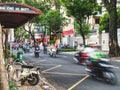 Ho Chi Minh City street filled with mopeds and motorcycles