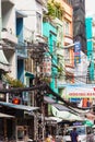 Ho Chi Minh City street in Vietnam with tangle of electrical wires Royalty Free Stock Photo