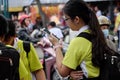 School girl stand with i phone, focus on smartphone after school