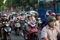 Ho Chi Minh city, Vietnam - April 19, 2015 : crowed scene of city traffic in rush hour, crowd of people wear helmet Royalty Free Stock Photo