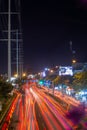 Ho Chi Minh City, Vietnam - April 23 2023: Timelapse exposure photo with red light on Pham Van Dong street, Ho Chi Minh City