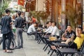 HO CHI MINH CITY, VIETNAM - APRIL 24, 2019 : Unidentified people drink coffee, tea or juice fruit on cafe stall on sidewalk on