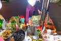 Vietnamese woman selling seafood on the counter and Snail`s for sale in a night market in Ho Chi Minh city Saigon, Vietnam. Foo