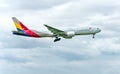 Boeing 777 passenger aircraft of Asiana Airlines is preparing to land at Tan Son Nhat International Airport Royalty Free Stock Photo