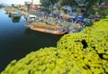 Flowers boat at flower market along canal wharf