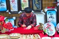 Vietnamese scholar writes calligraphy at lunar new year calligraphy festival