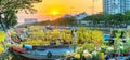 Flower boats full of flowers parked along canal wharf in sunset Royalty Free Stock Photo