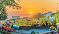 Flower boats full of flowers parked along canal wharf in sunset Royalty Free Stock Photo