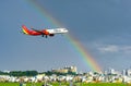 Vietjet airbus a321 landing with rainbow behind sky into Tan Son Nhat International Airport