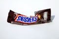 Snickers chocolate bar empty crumpled wrapper isolated on white