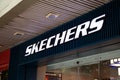 Popular shoe store business sign with a white Skechers logo