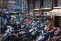 Ho Chi Minh City, Vietnam - November 10, 2022: Parking space for motor bikes and Scooter on the sidewalk at Saigon. Mopeds are the