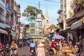 Ho Chi Minh City, Vietnam: a picturesque street of Cholon occupied by market activity, with townhouses and Cha Tam Church Royalty Free Stock Photo