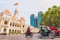 Ho Chi Minh City, Vietnam: Saigon City Hall, Vincom Center towers and colorful street traffic blurred in motion